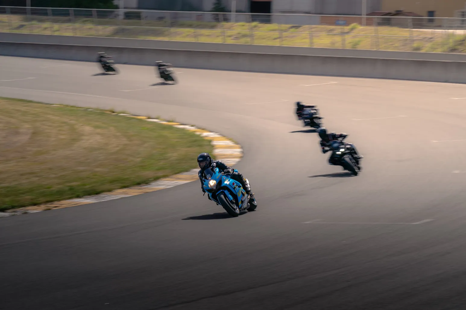 Group of riders following each other through a curve