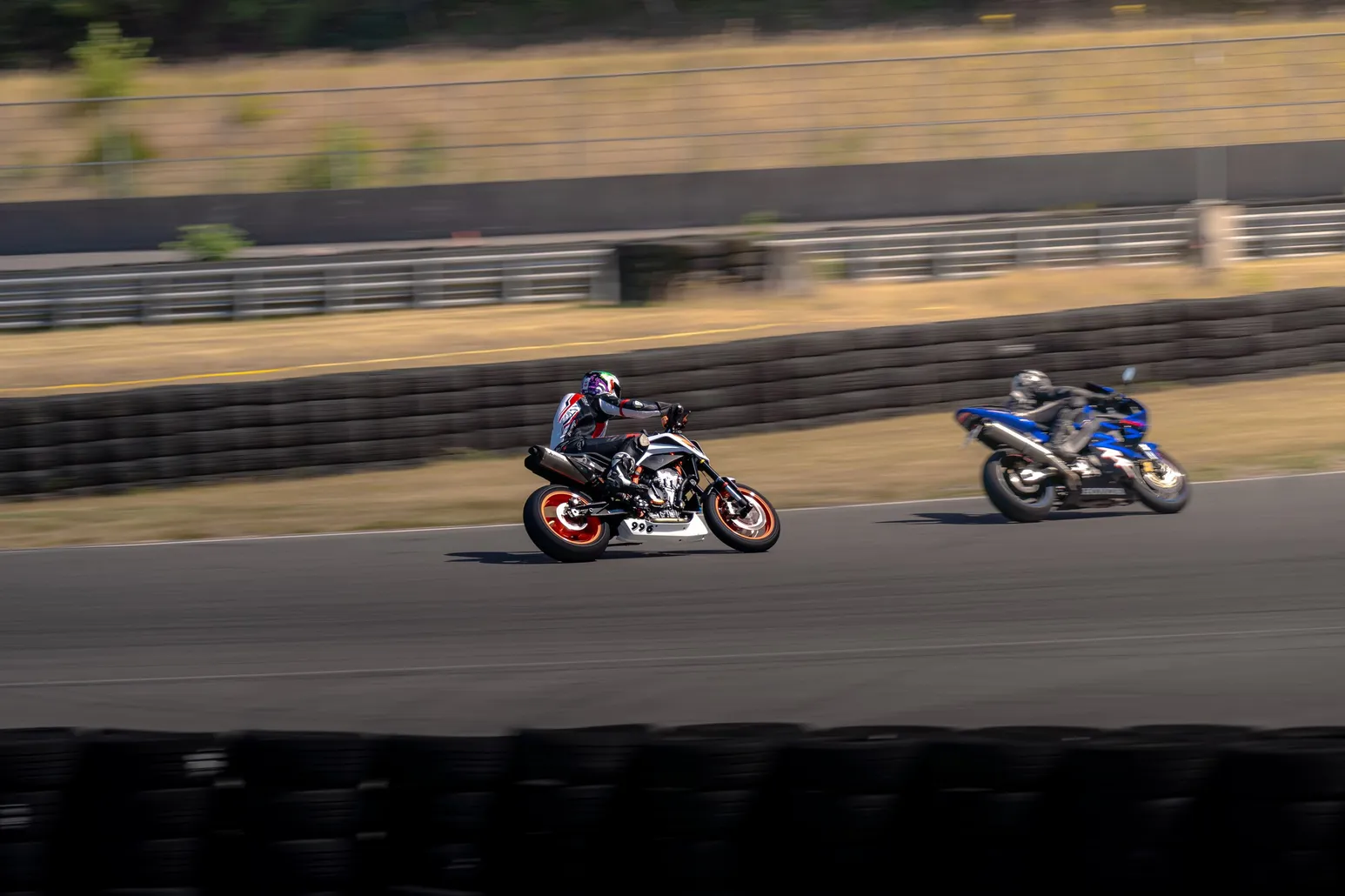 Two motorcycles side by side on the straight