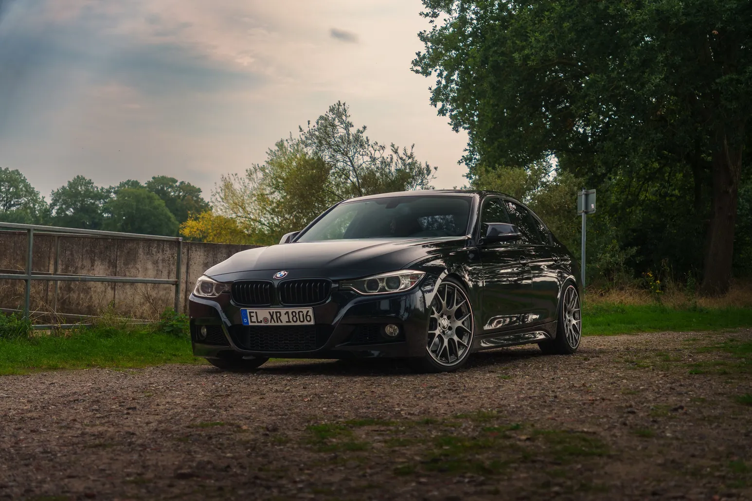 Black BMW F30 front three-quarter view, low angle