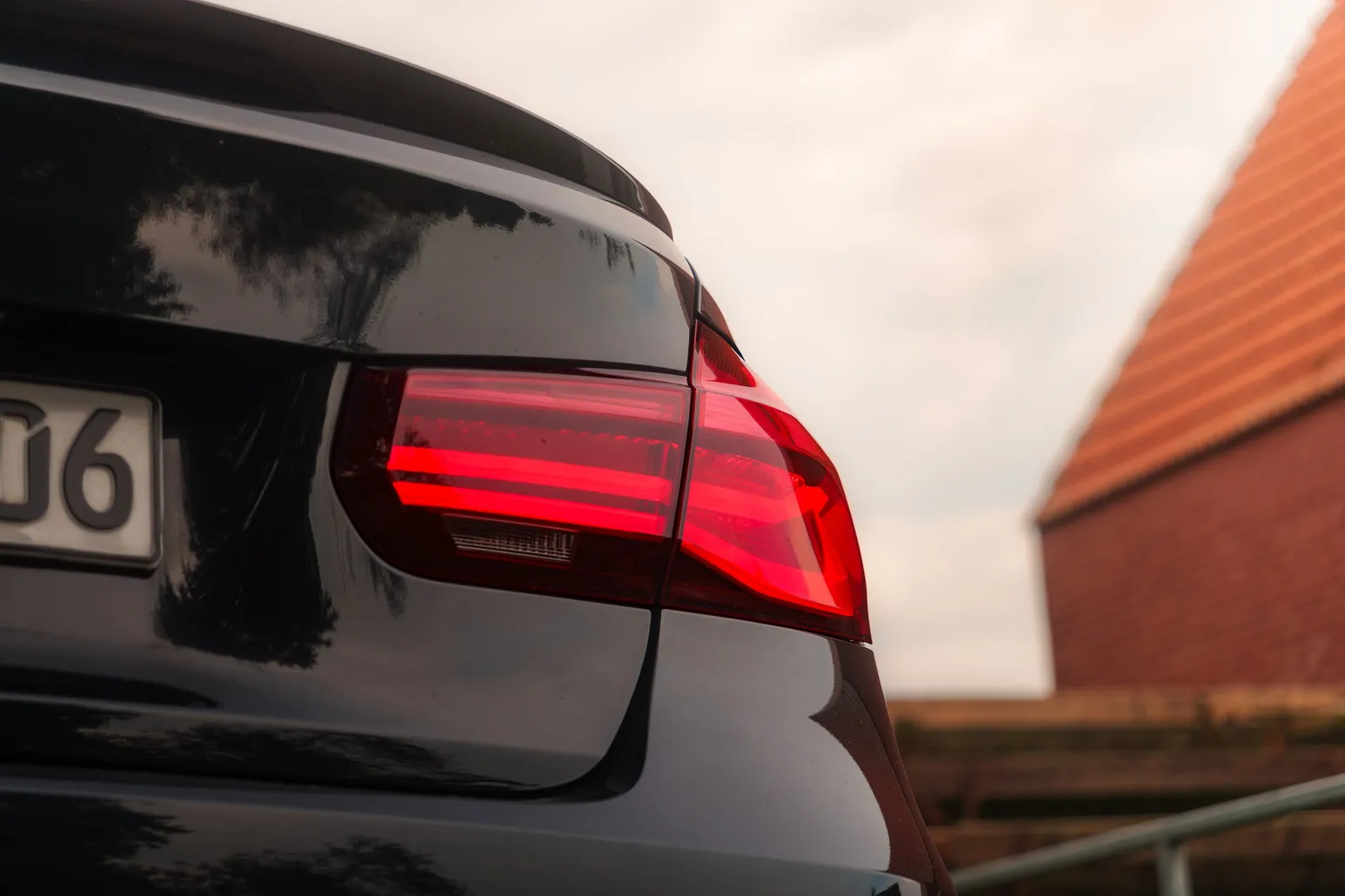 BMW F30 tail light in close-up against the barn