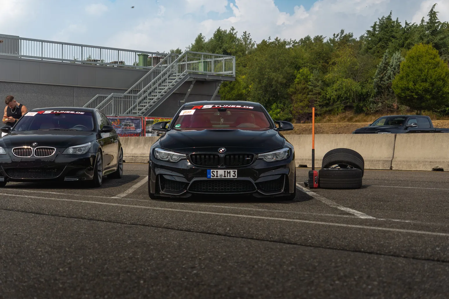 Black BMW M3 and M4 parked side by side