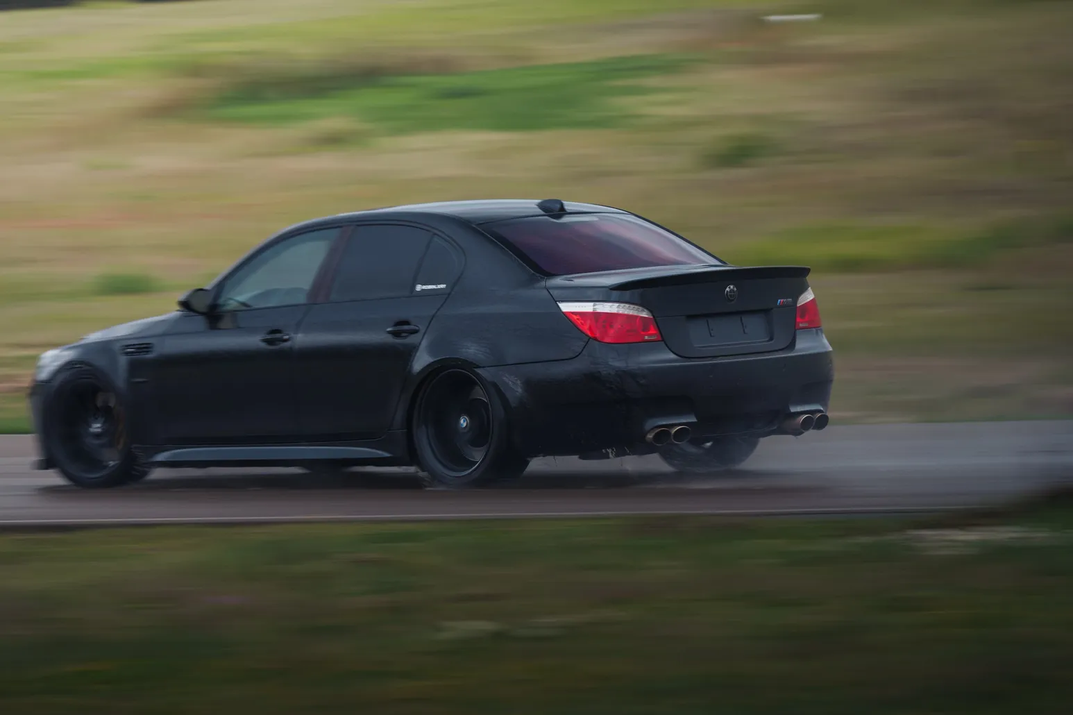 Black BMW M5 (E60) panning shot