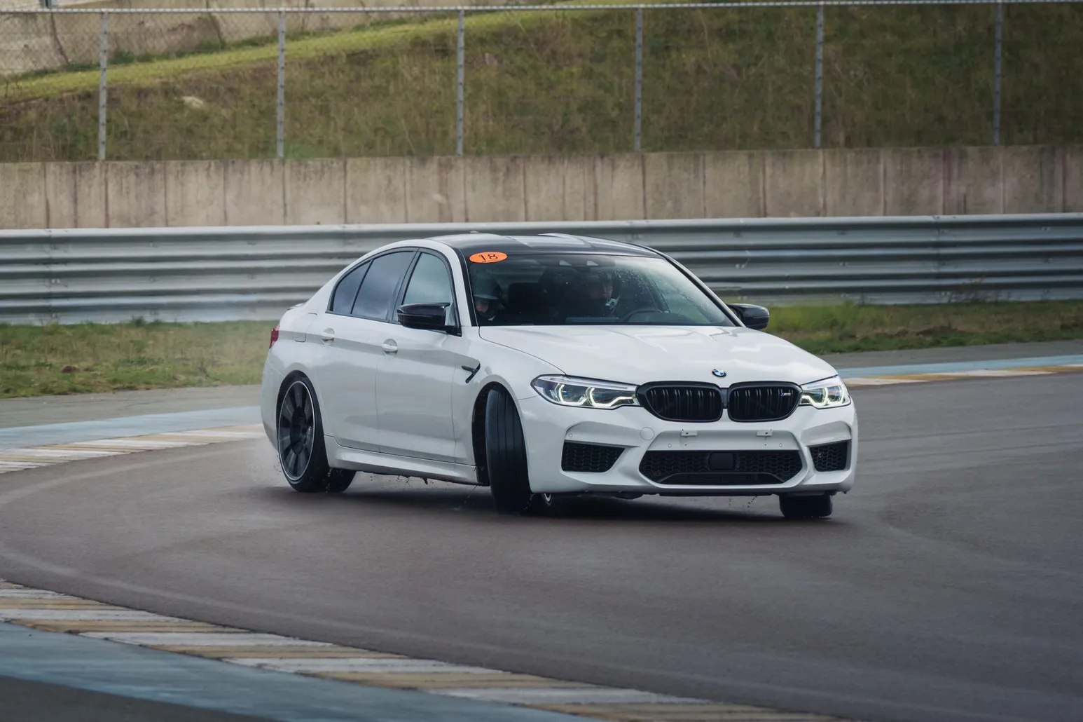 White BMW M5 (F90) from the front three-quarter