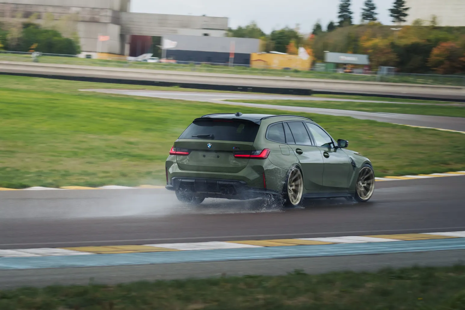 BMW M3 Touring drifting, seen from behind