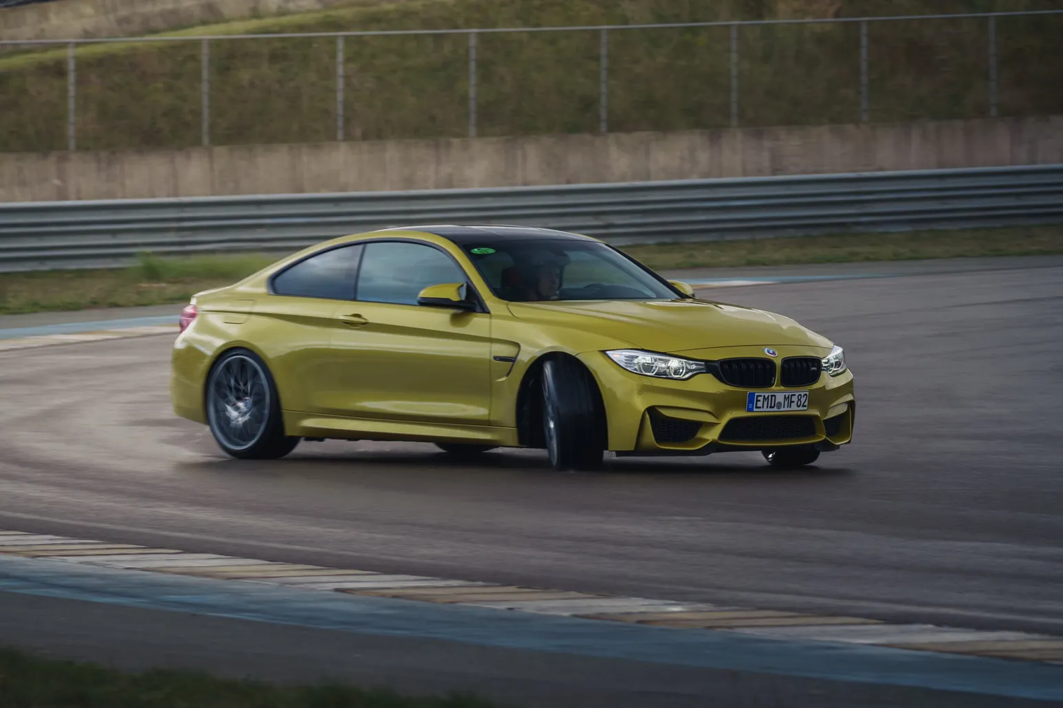 Yellow BMW M4 (F82) from the front three-quarter