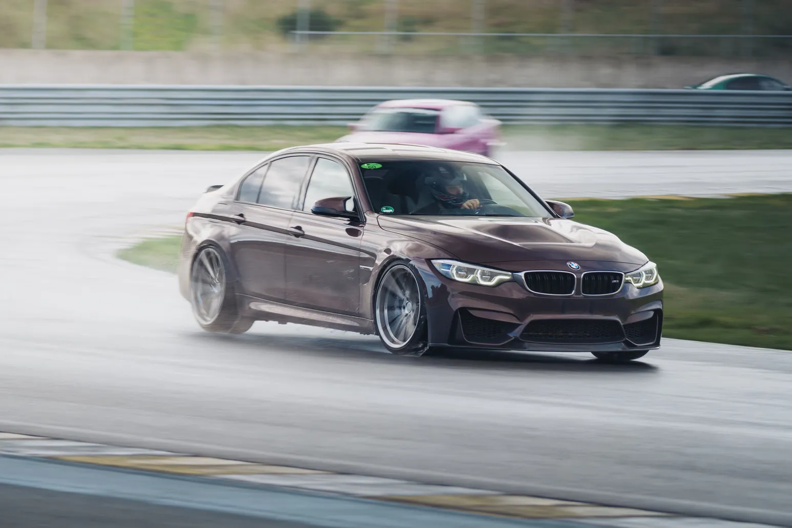 Purple BMW M3 (F80) drifting head-on