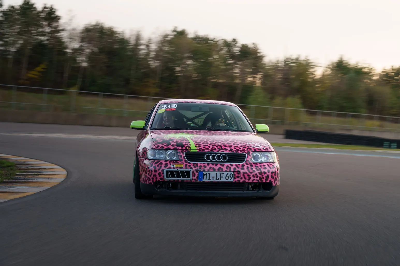 Leopard-print Audi A3 head-on on track