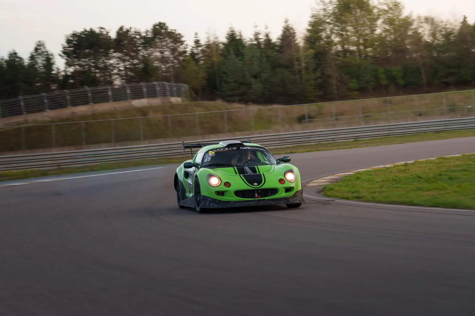 Green Lotus Elise through a corner