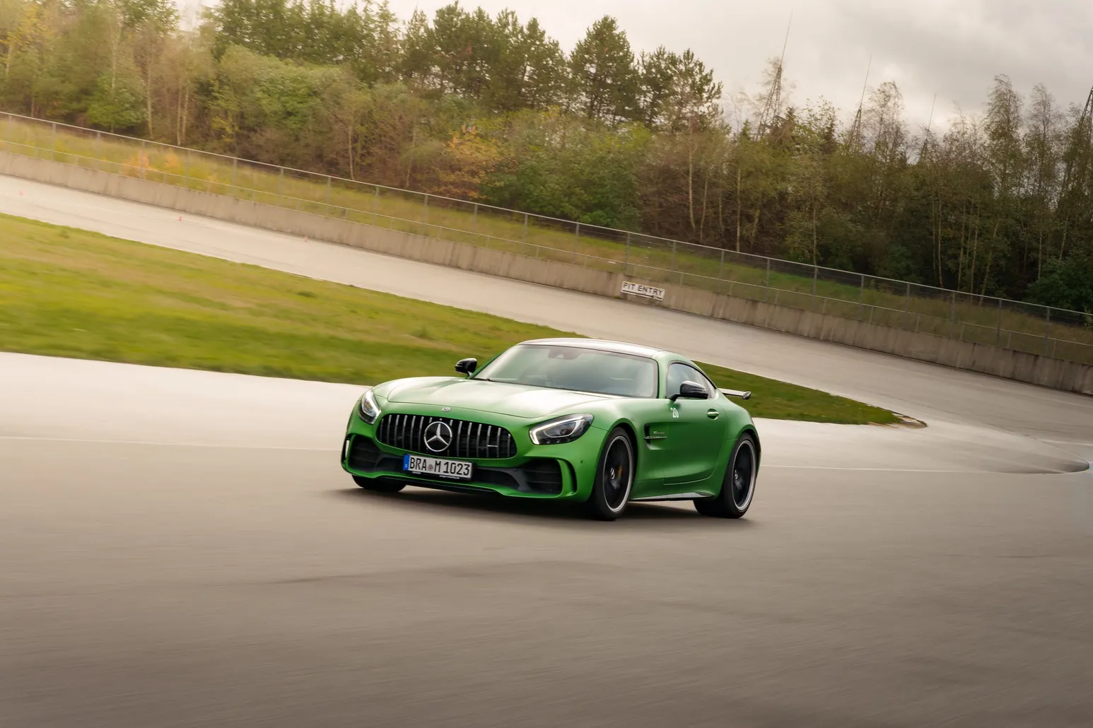 Green Mercedes-AMG GT R in front of the embankment