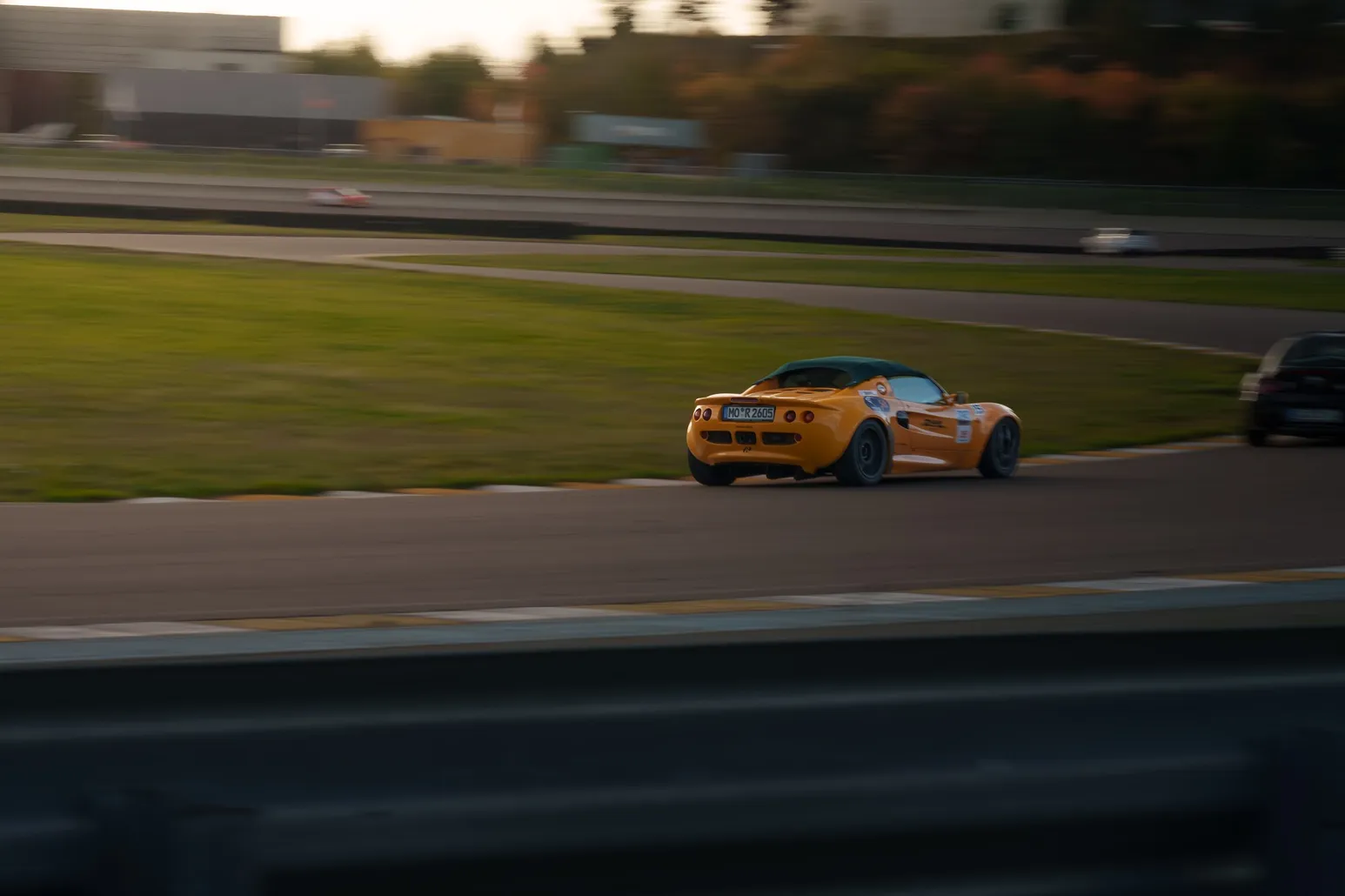 Orange Lotus Elise in a corner