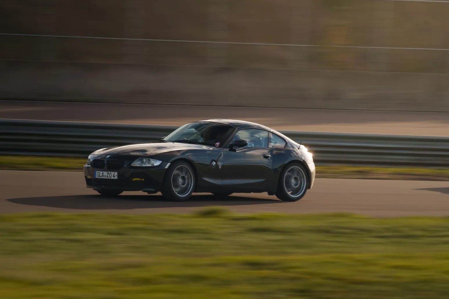 Black BMW Z4 M Coupé panning shot