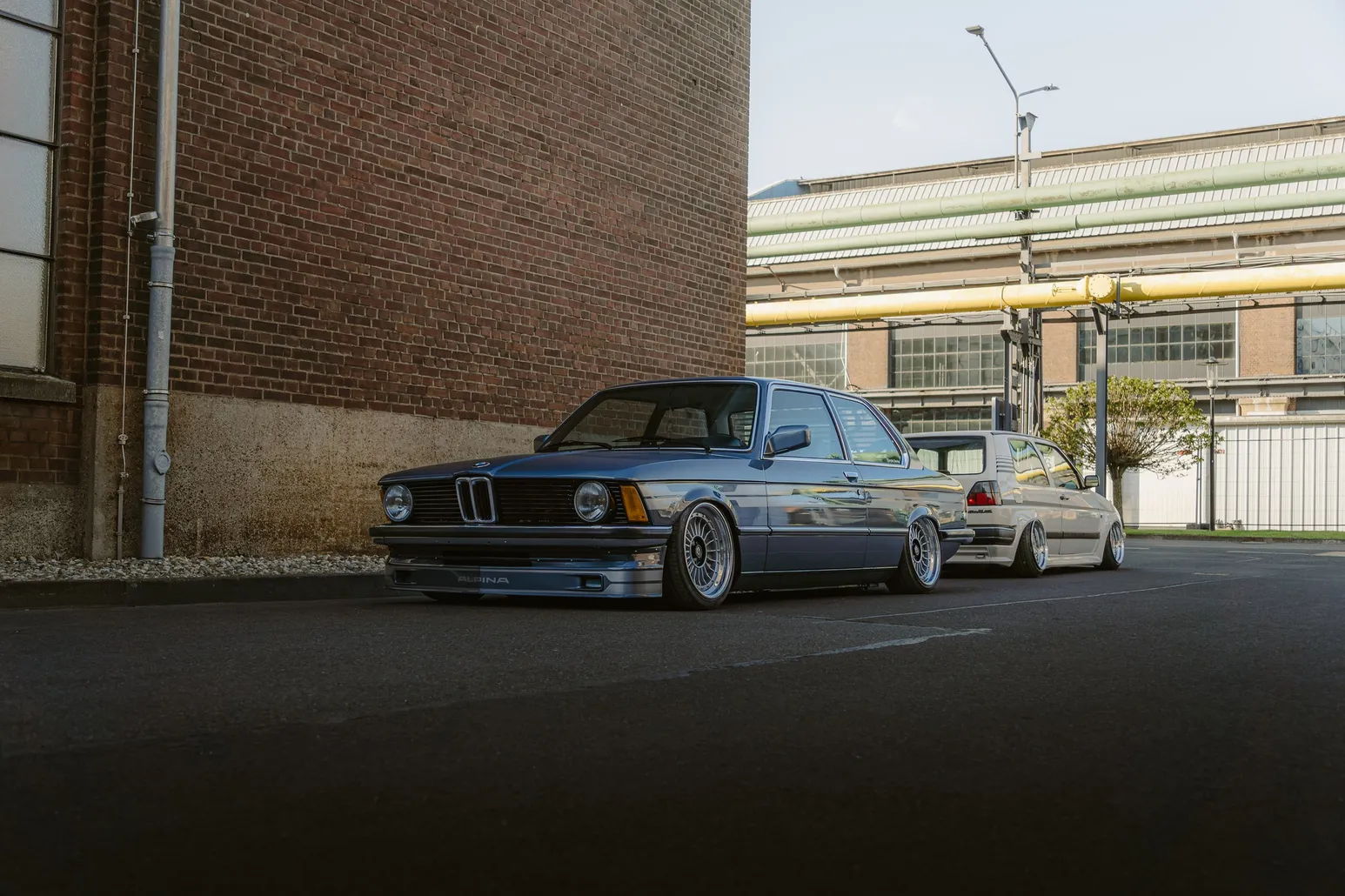 Silver BMW E21 3 Series in front of a brick wall
