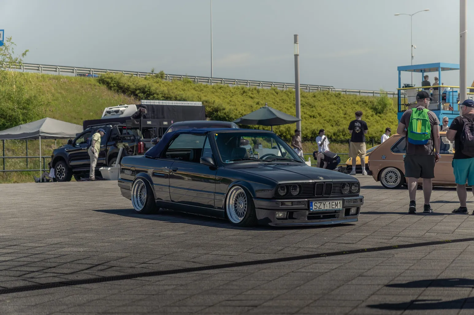 Black BMW E30 on the event grounds