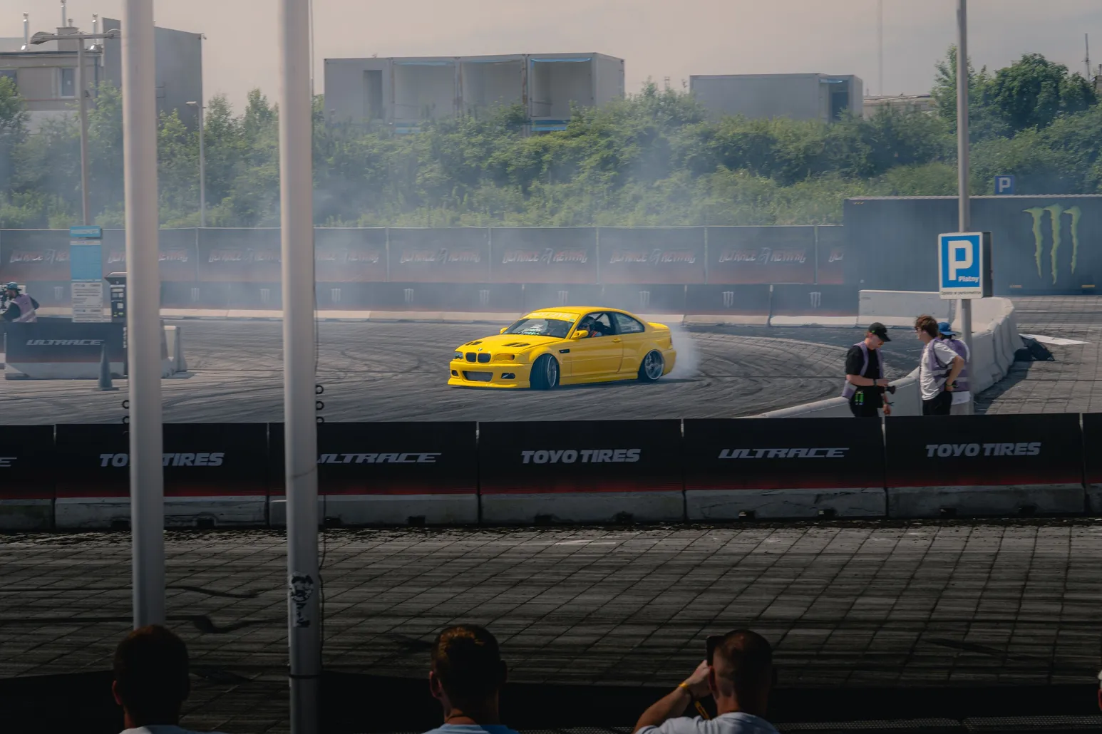 Yellow BMW E46 drifting with smoke