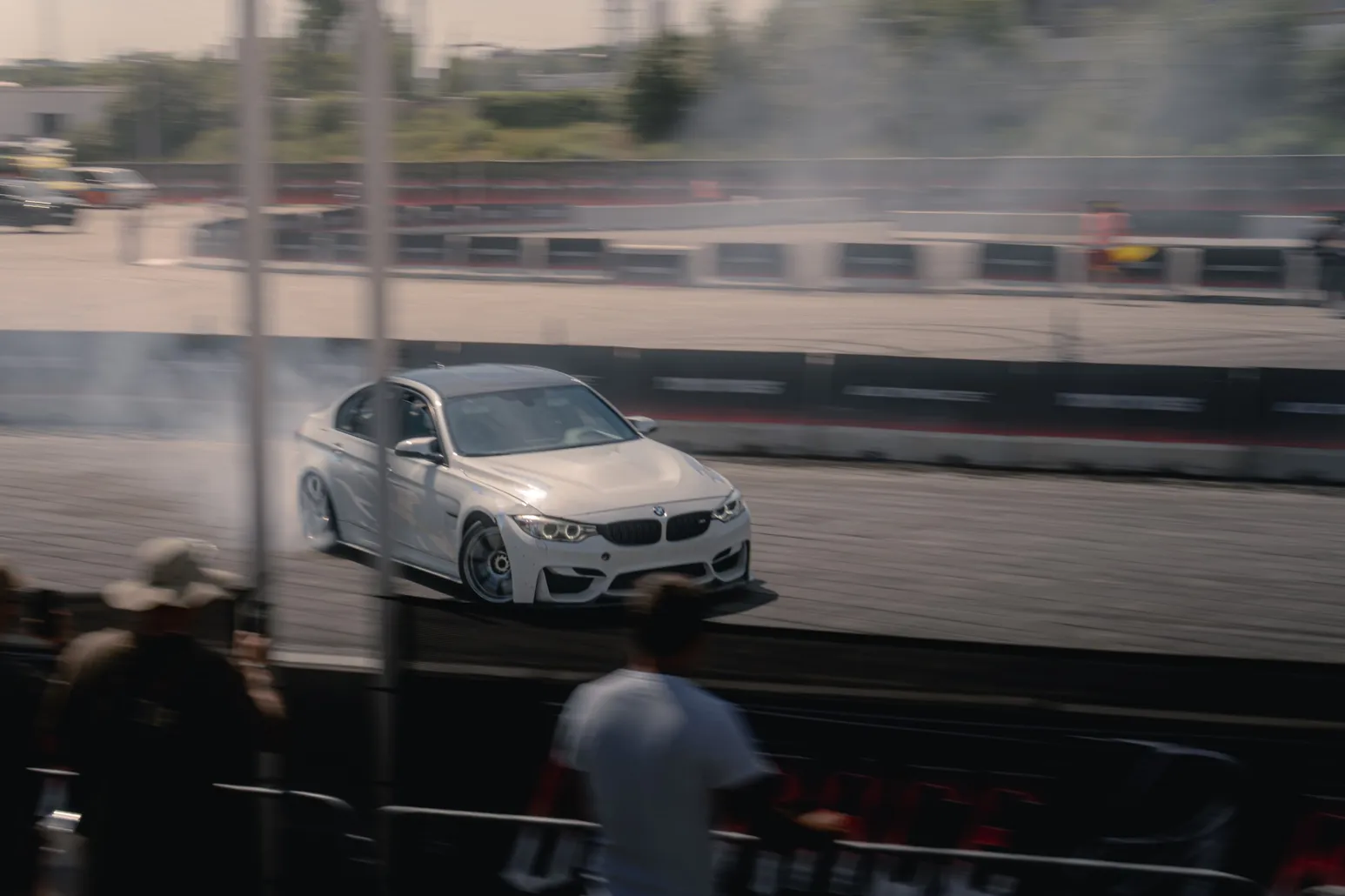 White BMW M4 drifting with smoke