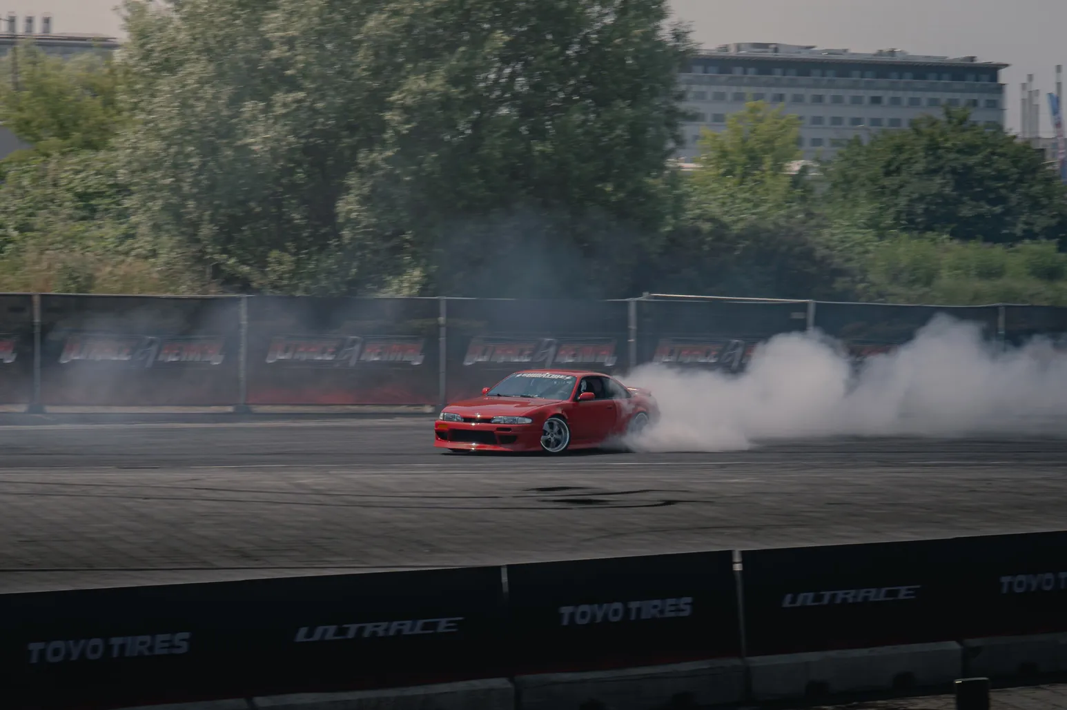 Red drift car with thick smoke