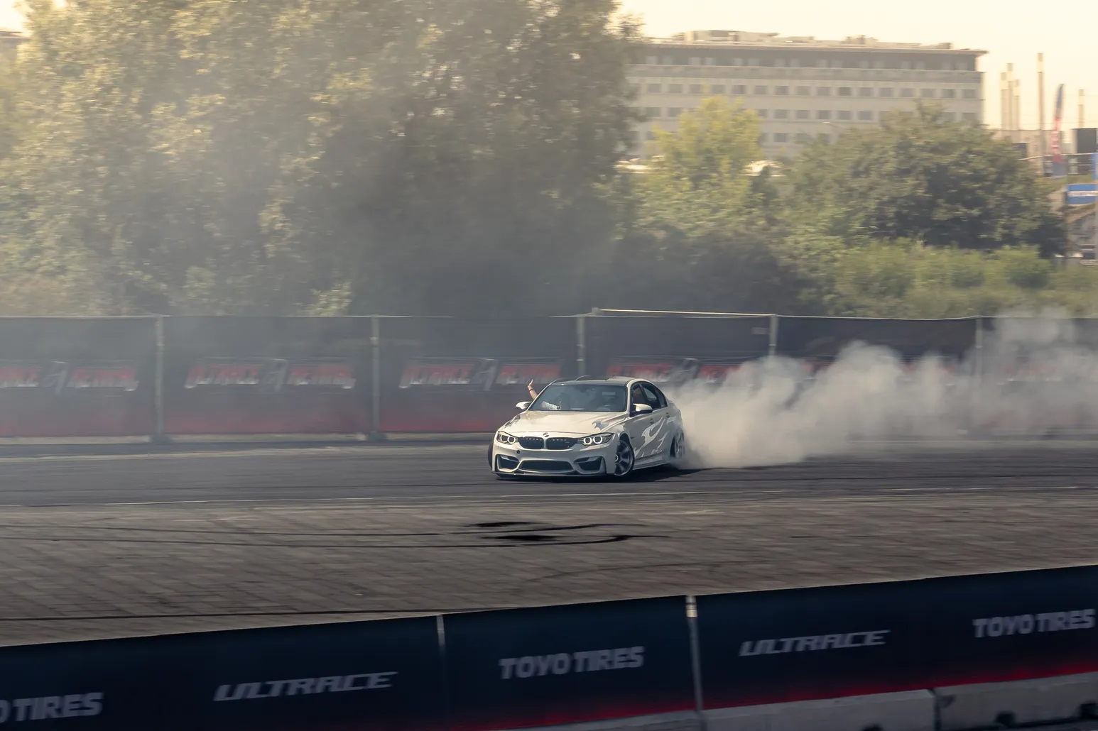 White BMW M4 in a large cloud of smoke