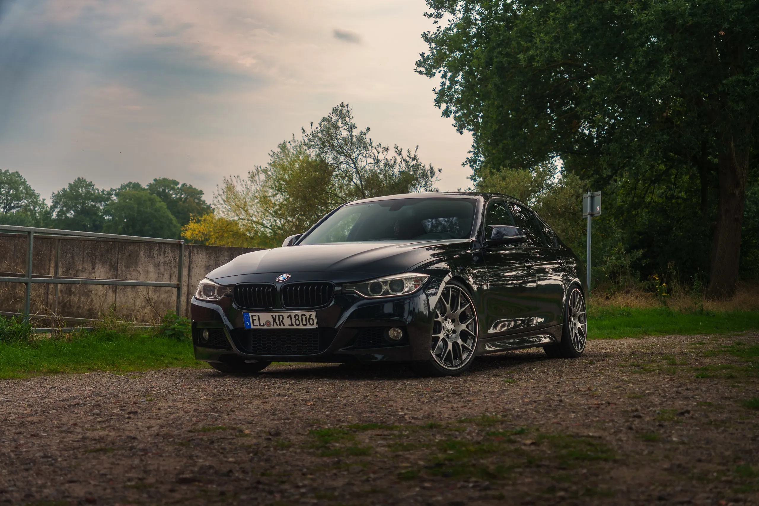 Black BMW F30 front three-quarter view, low angle