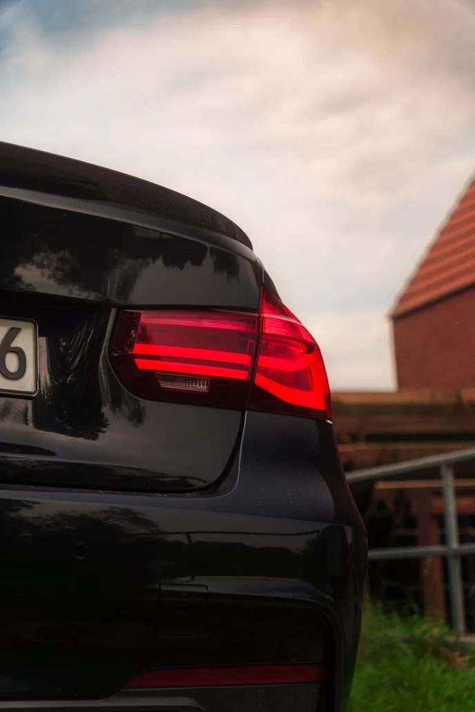 Tail light detail with brick roof, portrait format