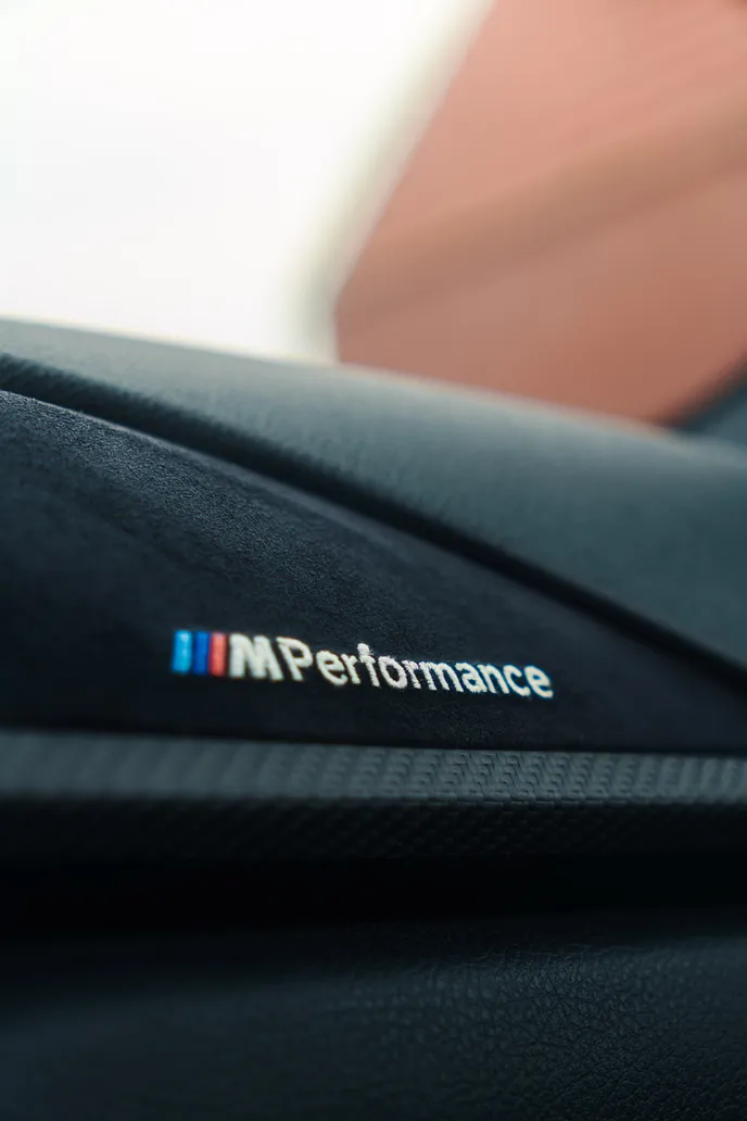 M Performance logo on the alcantara dashboard