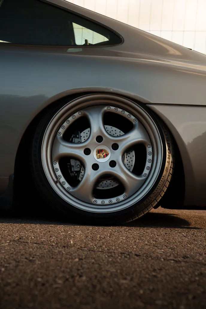 Detail of a Porsche wheel in the evening light