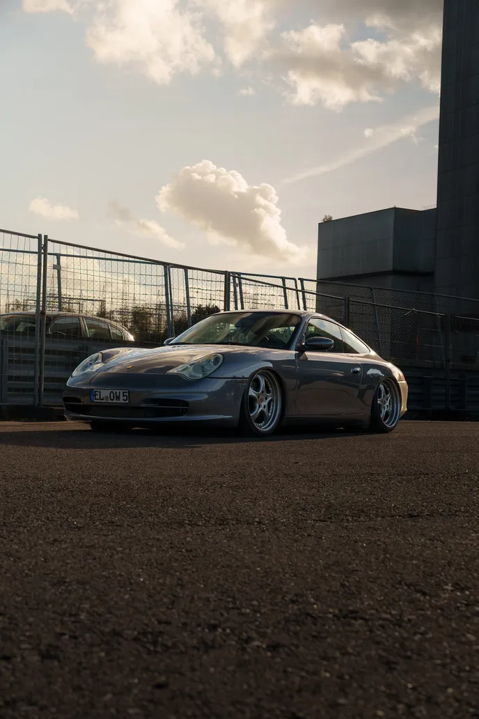 Porsche 996 in portrait format against the evening sky