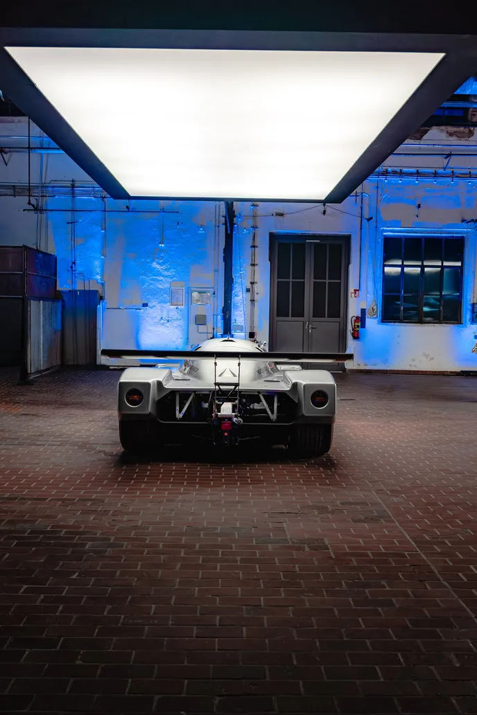 Rear of the Group C race car in blue light, portrait format