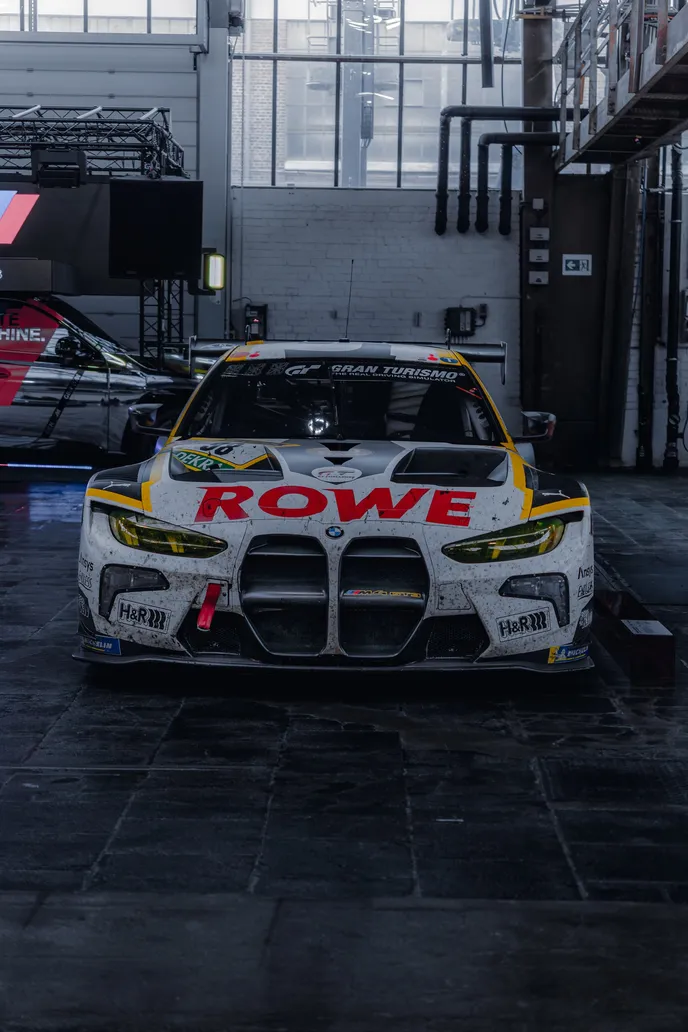 BMW M4 GT3 in ROWE livery head-on, portrait format