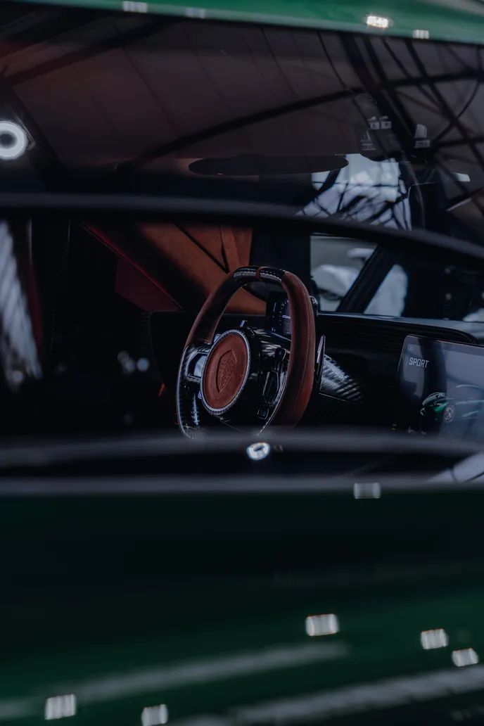 Steering wheel inside a classic car, portrait format