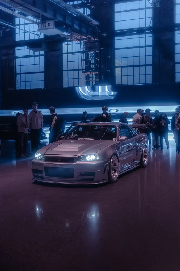 Silver sports car in the hall’s blue evening light, portrait format