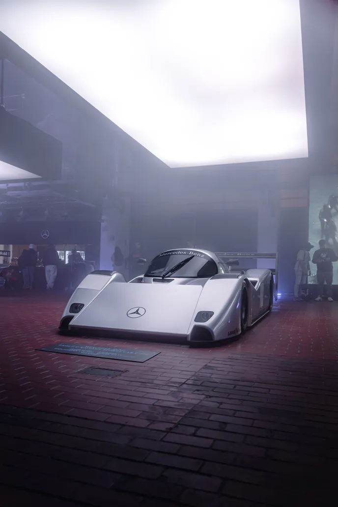 Group C race car head-on in haze, portrait format