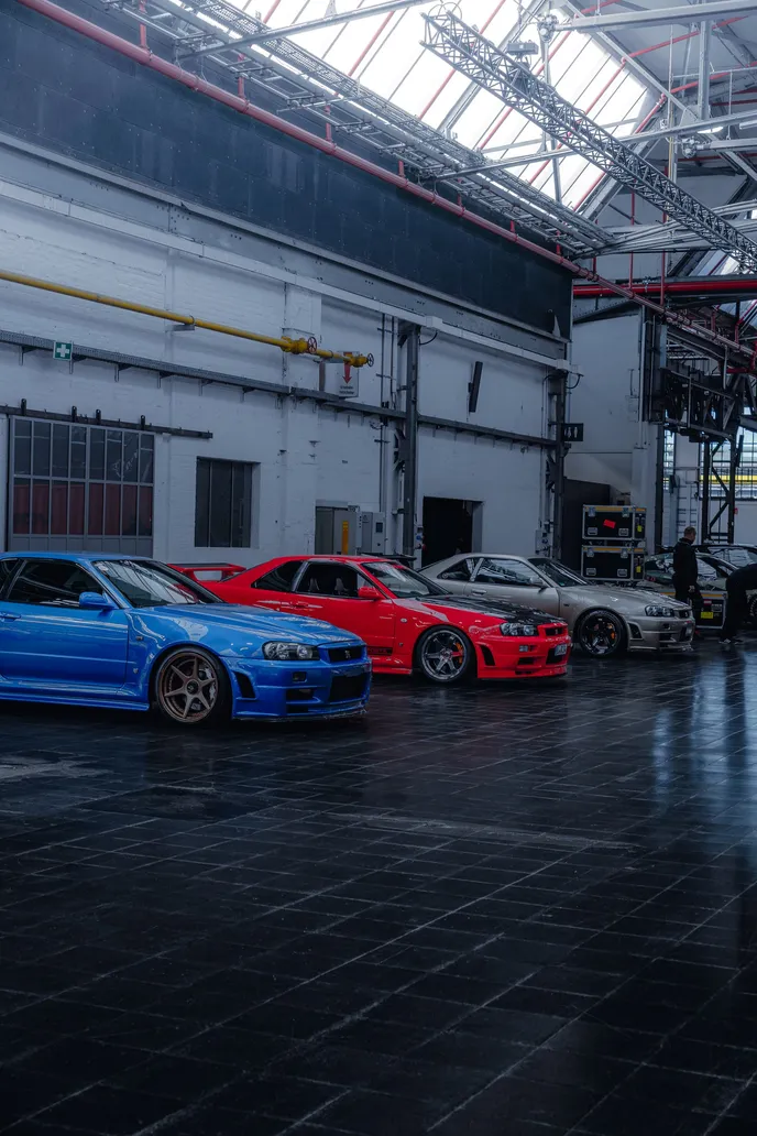 Row of Nissan Skylines in the hall, portrait format
