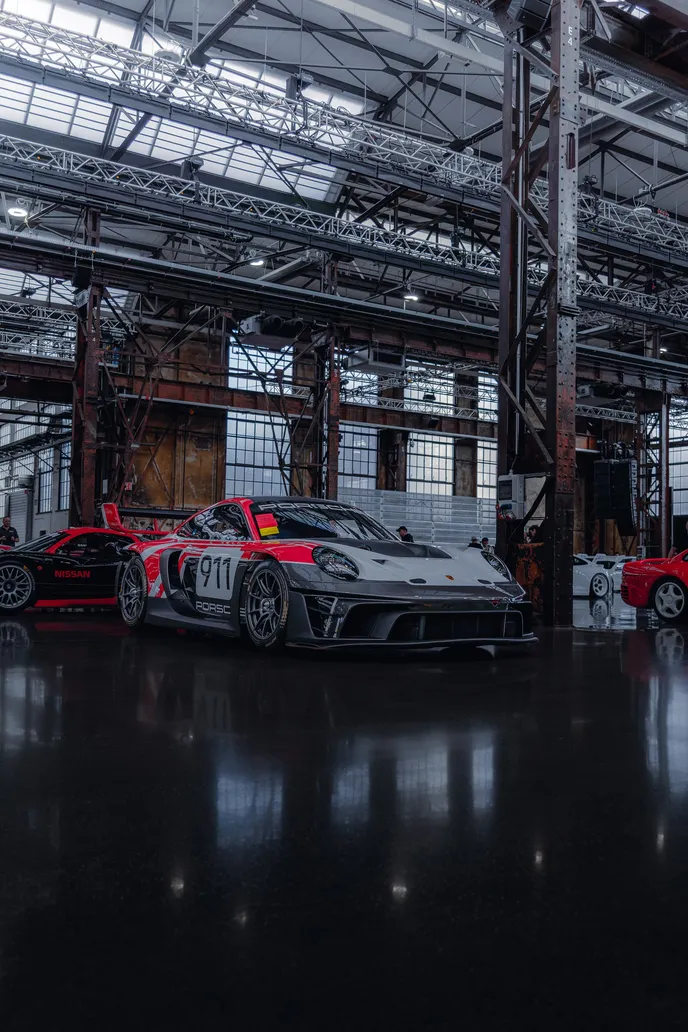 Porsche 911 GT3 R reflected in the hall floor, portrait format