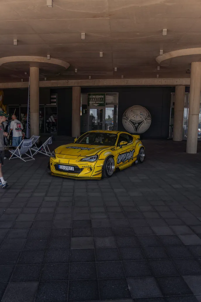 Yellow Toyota GT86 under the canopy, portrait format